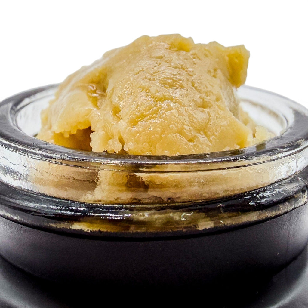 Dr. Wonderstone premium THCa live rosin concentrate with a smooth, buttery texture in a small glass jar.