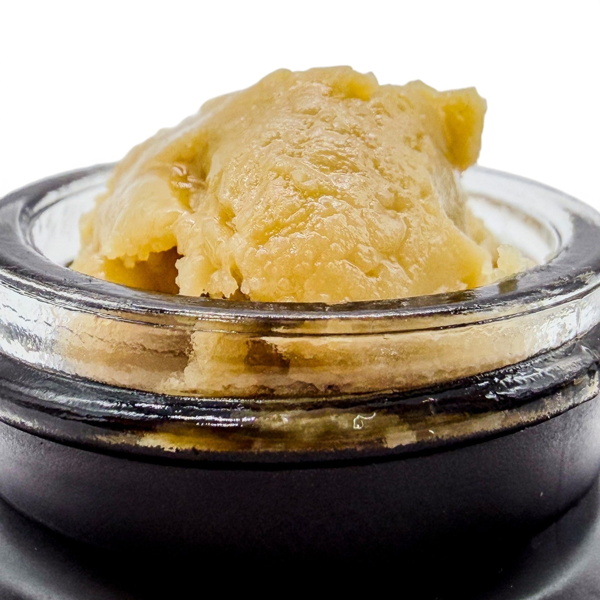 Dr. Wonderstone premium THCa live rosin concentrate with a smooth, buttery texture in a small glass jar.