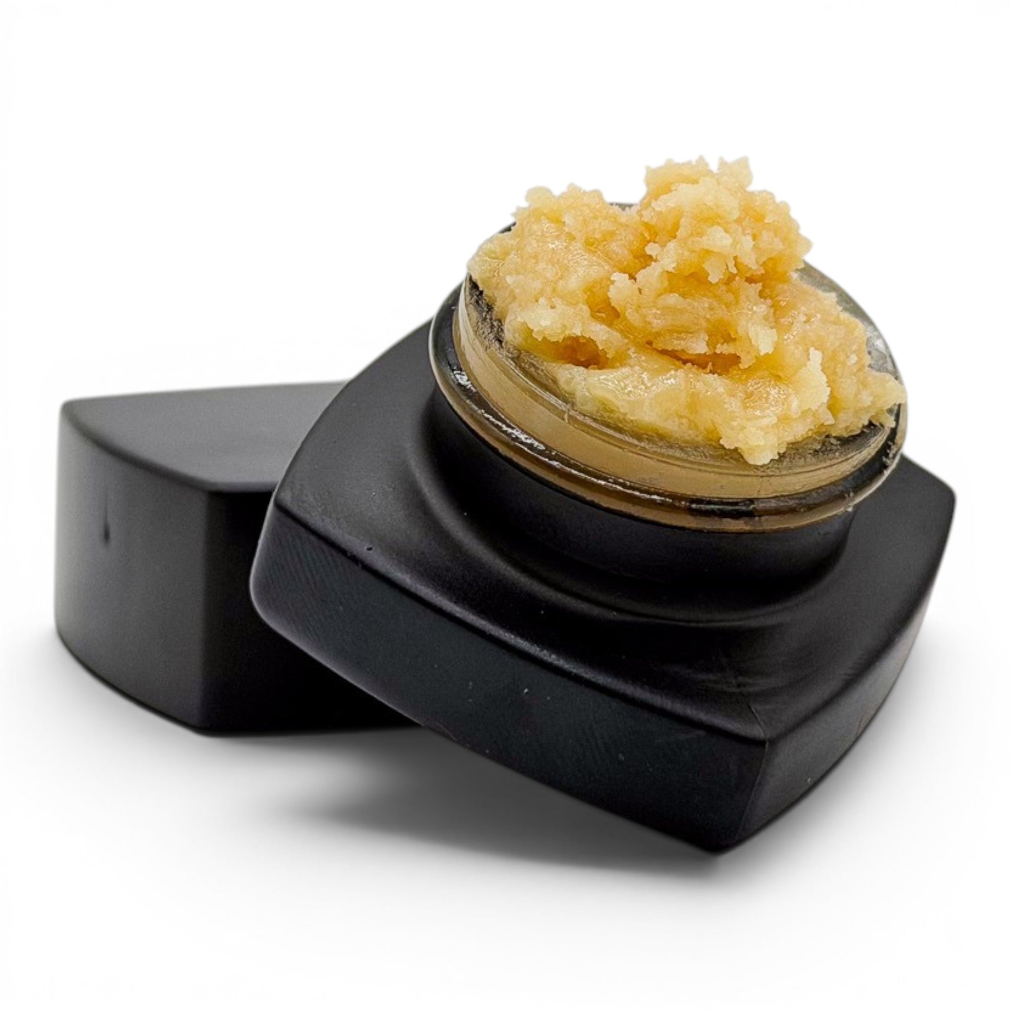 Dr. Wonderstone THCa premium live rosin concentrate with a buttery texture in a small black glass jar.