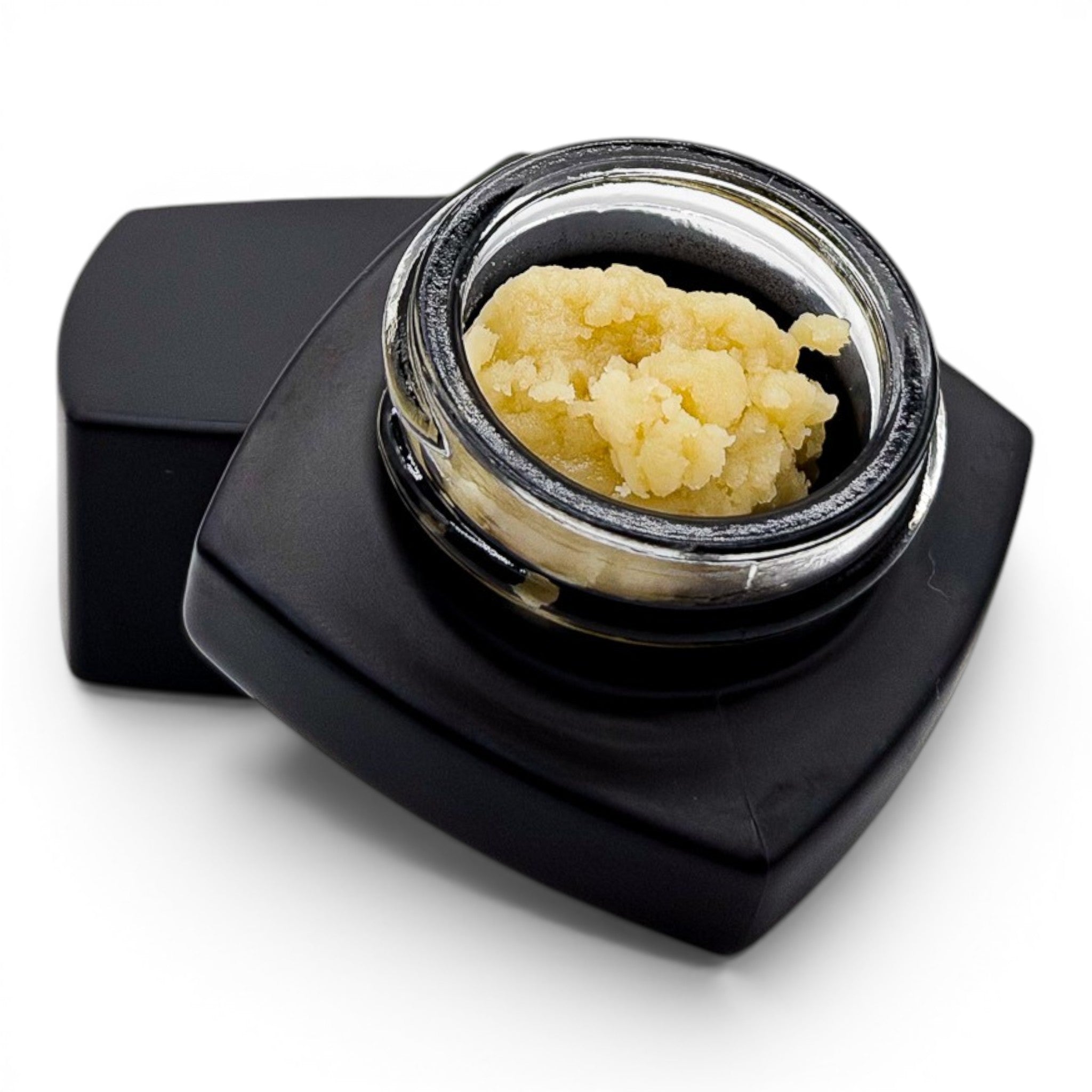 Dr. Wonderstone THCa premium live rosin concentrate with a buttery texture in a small black glass jar.