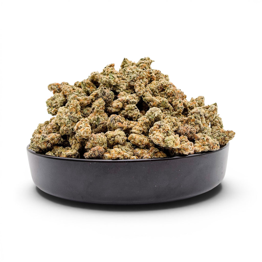 Dr. Wonderstone Toffee Headz premium THCa flower buds with green and orange hues in a black bowl.