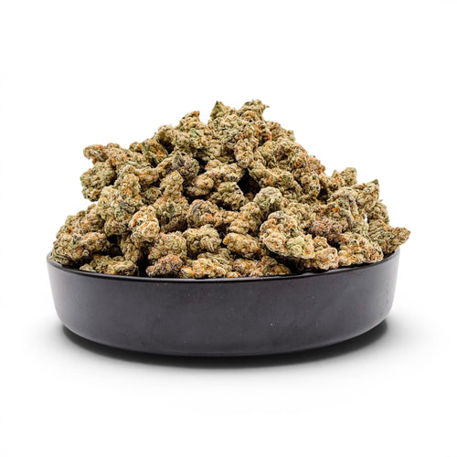 Dr. Wonderstone Toffee Headz premium THCa flower buds with green and orange hues in a black bowl.