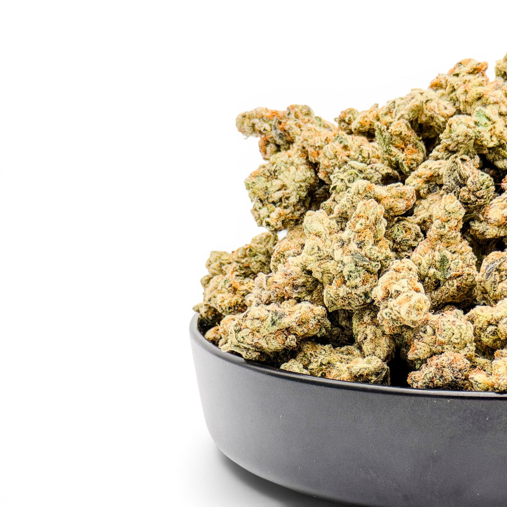 Dr. Wonderstone Toffee Headz premium THCa flower buds with orange pistils in a black bowl on white background