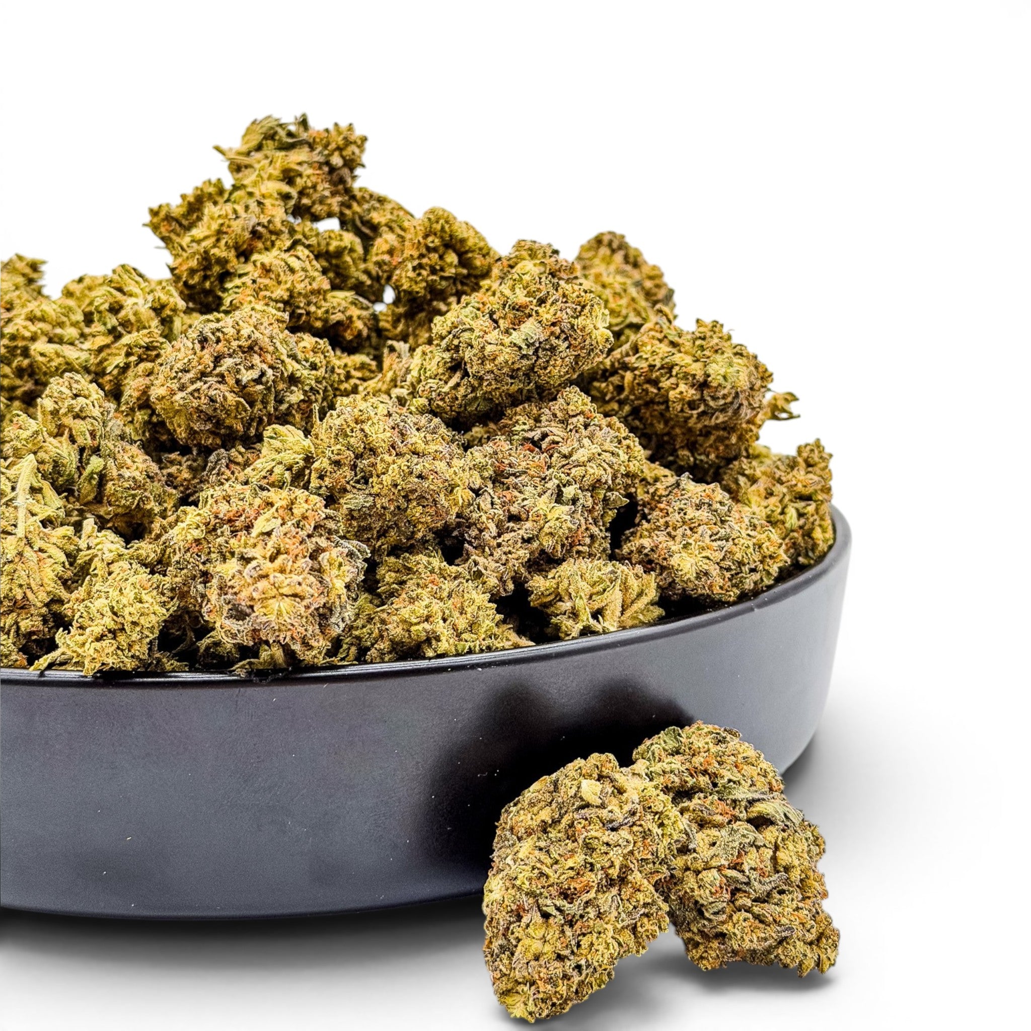 Dr. Wonderstone Wedding Cake THCa flower buds with crystal-dusted green and orange textures in a black bowl.
